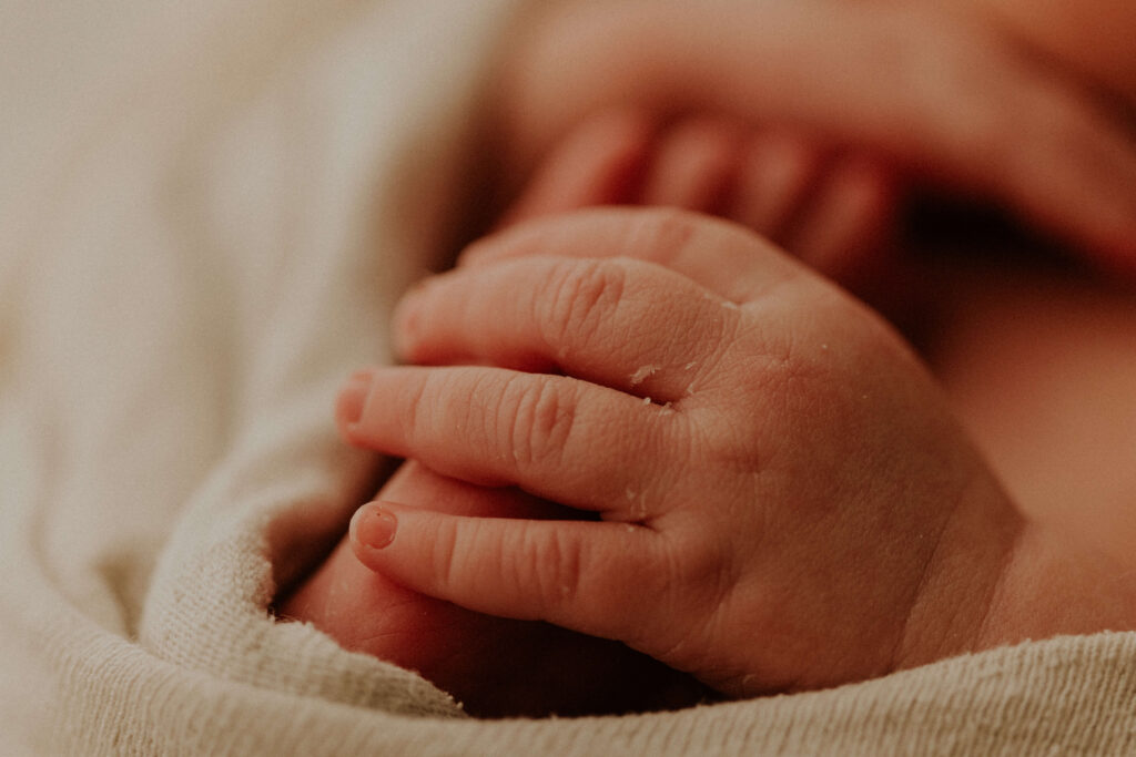 close up of newborn fingers