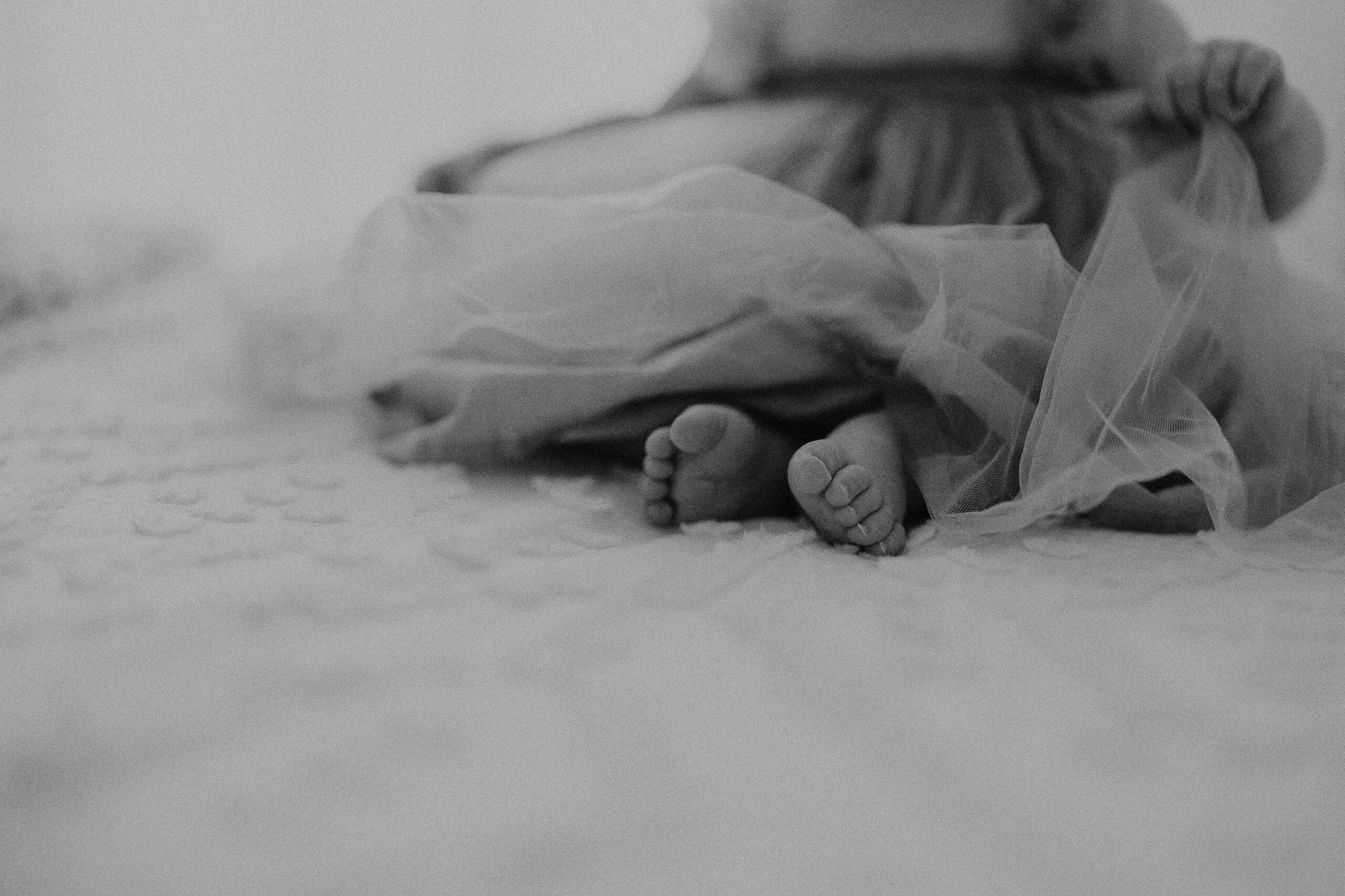 toddler feet on boho bed