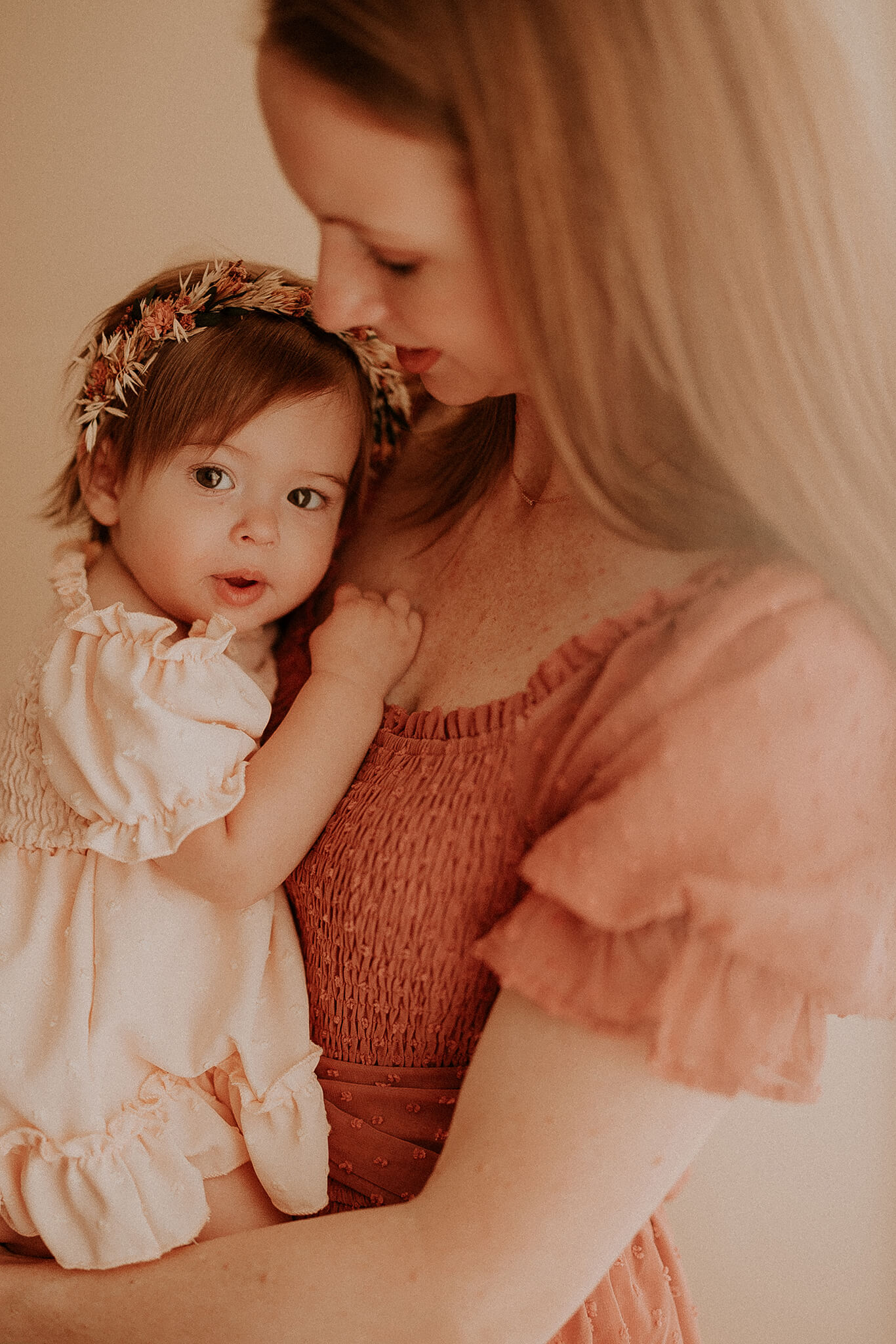 toddler snuggled with mom