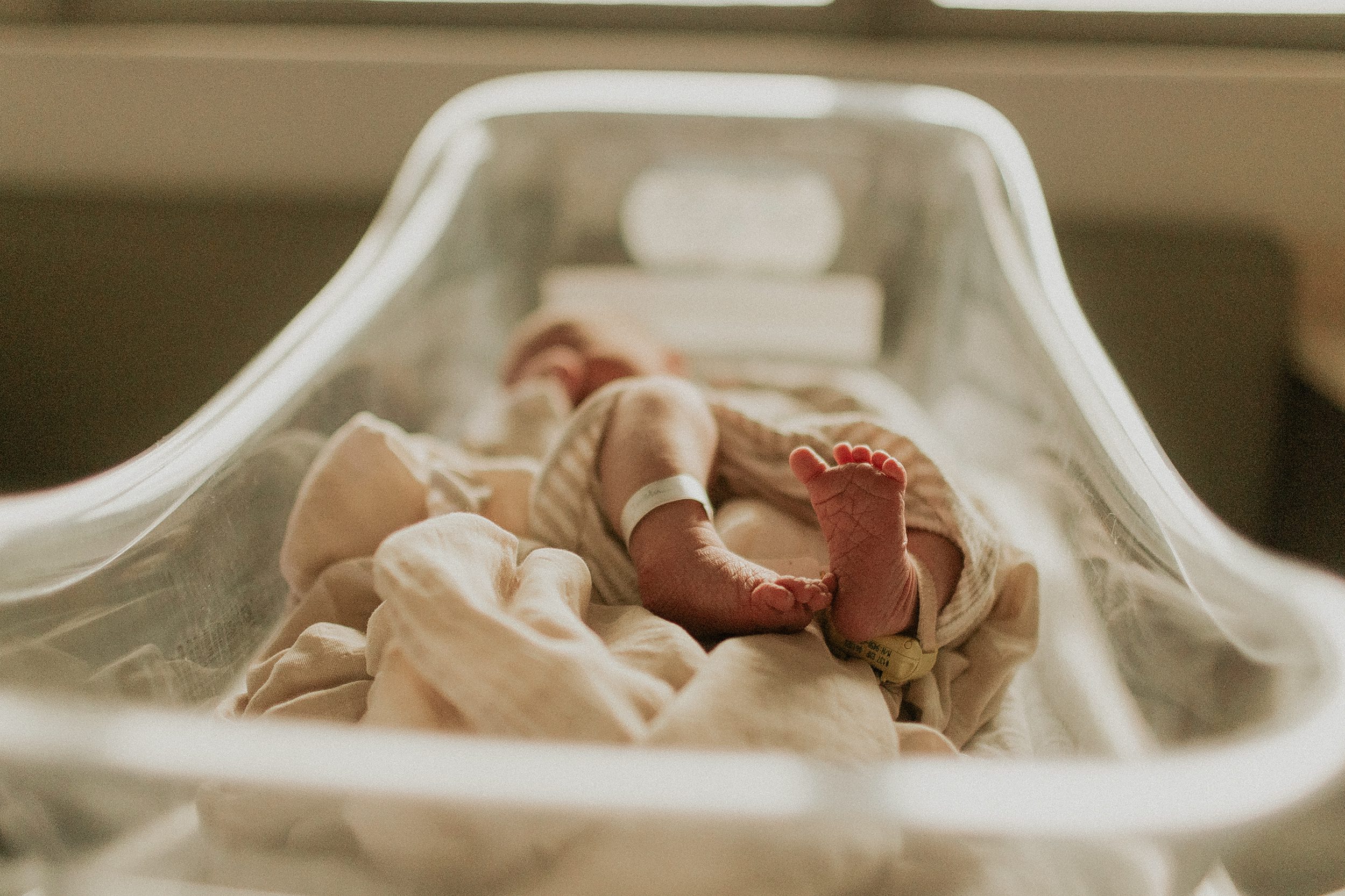 brand new baby feet in hospital after being born